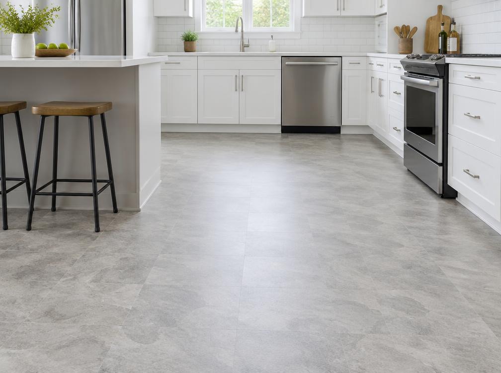 Sheet vinyl flooring fitted in a fitted kitchen with a stone tile pattern
